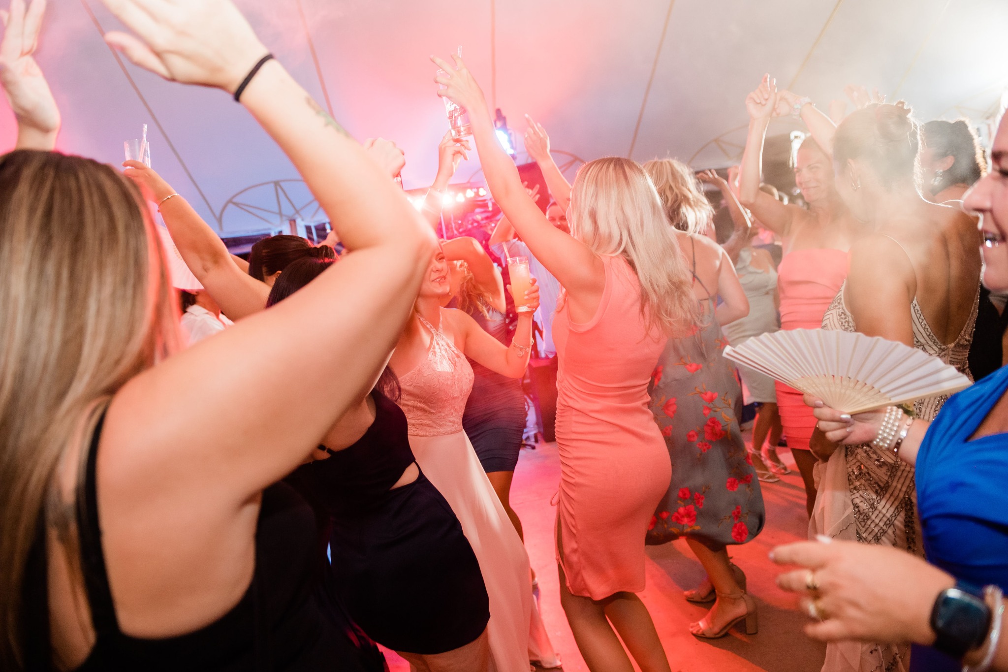Wedding guests celebrating together on a lively dance floor